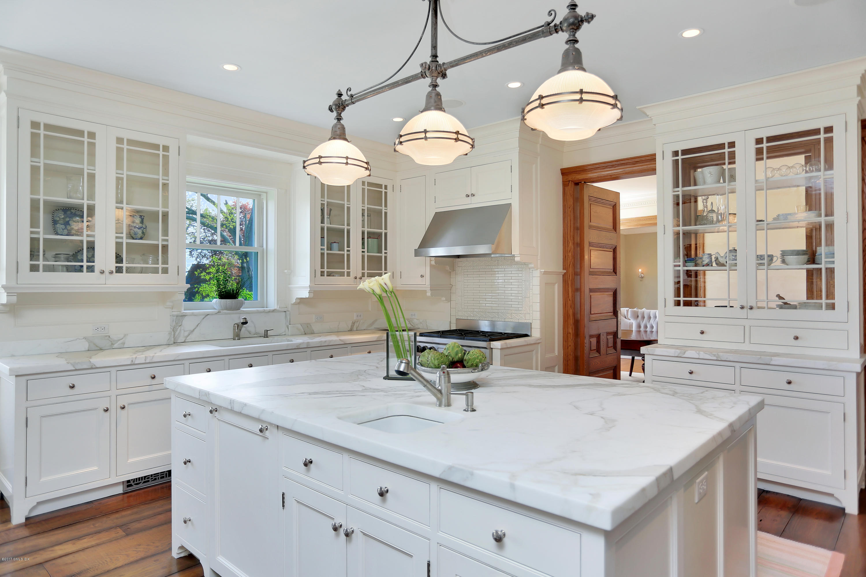 96 Club Road Riverside, CT 06878 - Photo 6 of 33 a view of a kitchen with a sink and chandelier