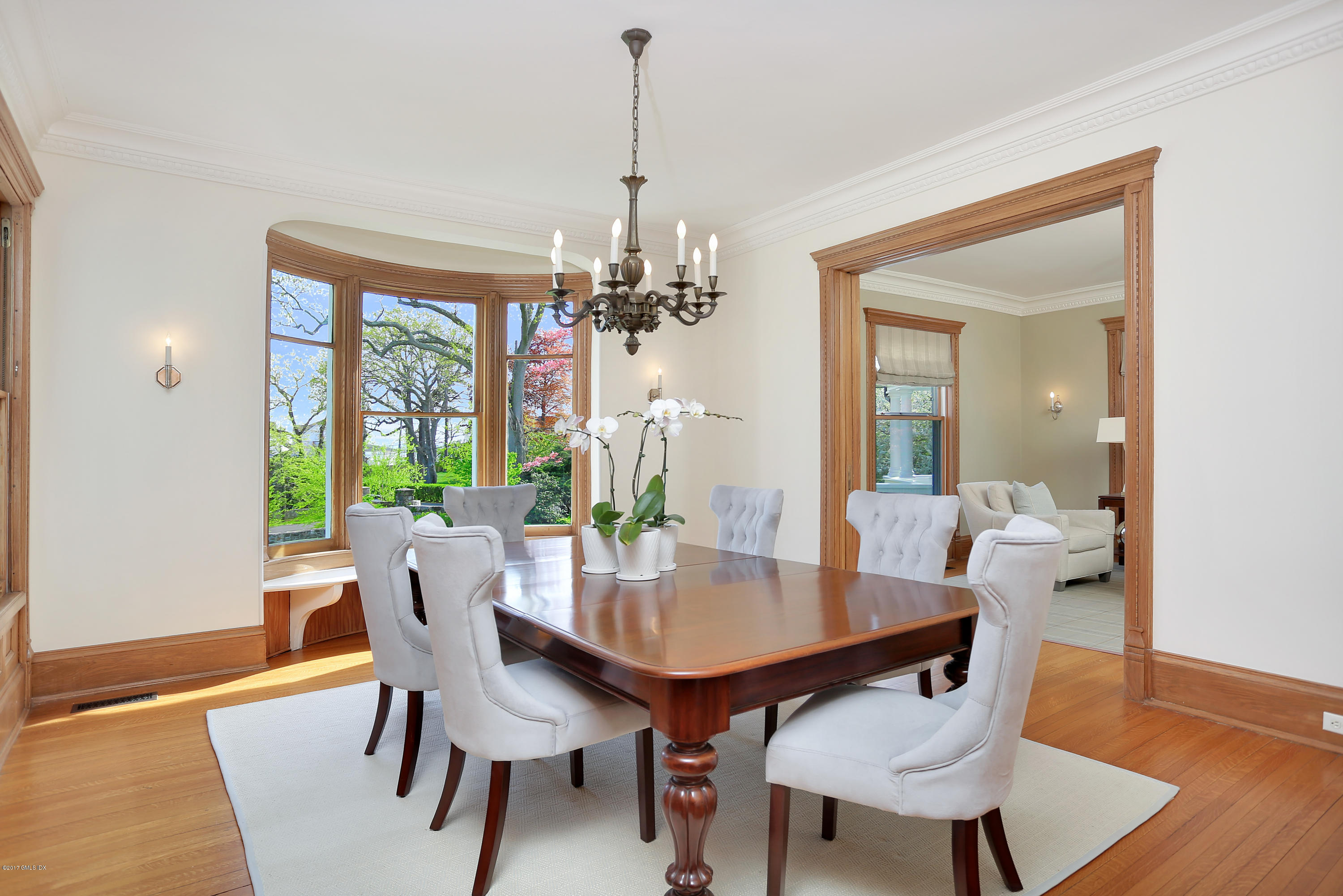 96 Club Road Riverside, CT 06878 - Photo 7 of 33 a view of a dining room with furniture wooden floor and chandelier