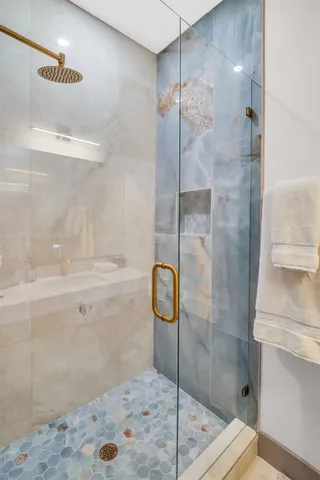 a bedroom with furniture and a flat screen tv