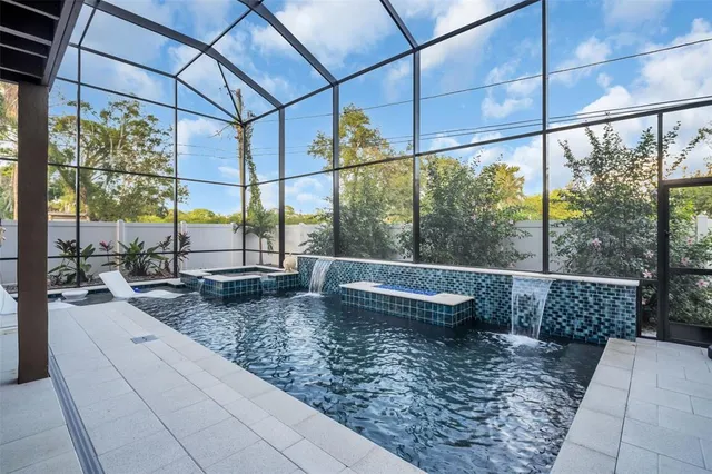 a view of a patio with a table and chairs