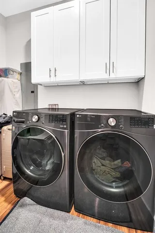 a view of a backyard with wooden fence