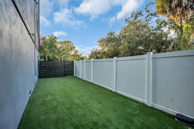 a picture of a room with a white wall and a picture