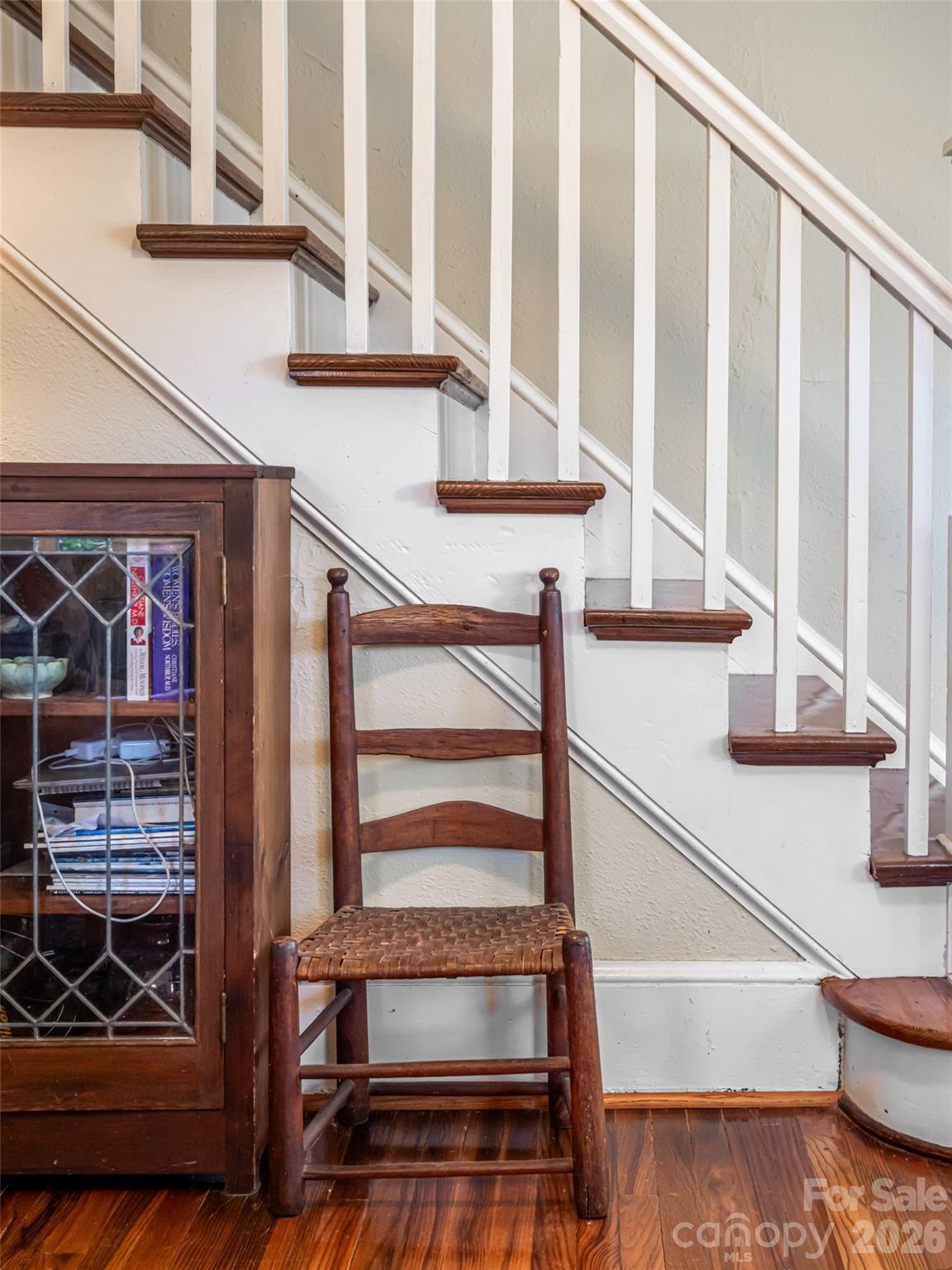352 Justice Ridge Road Candler, NC 28715 - Photo 13 of 48 a view of staircase with white walls and a window