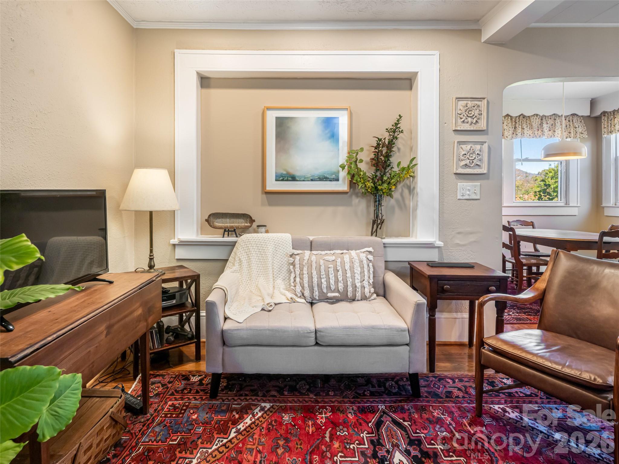 352 Justice Ridge Road Candler, NC 28715 - Photo 14 of 48 a living room with furniture and a lamp