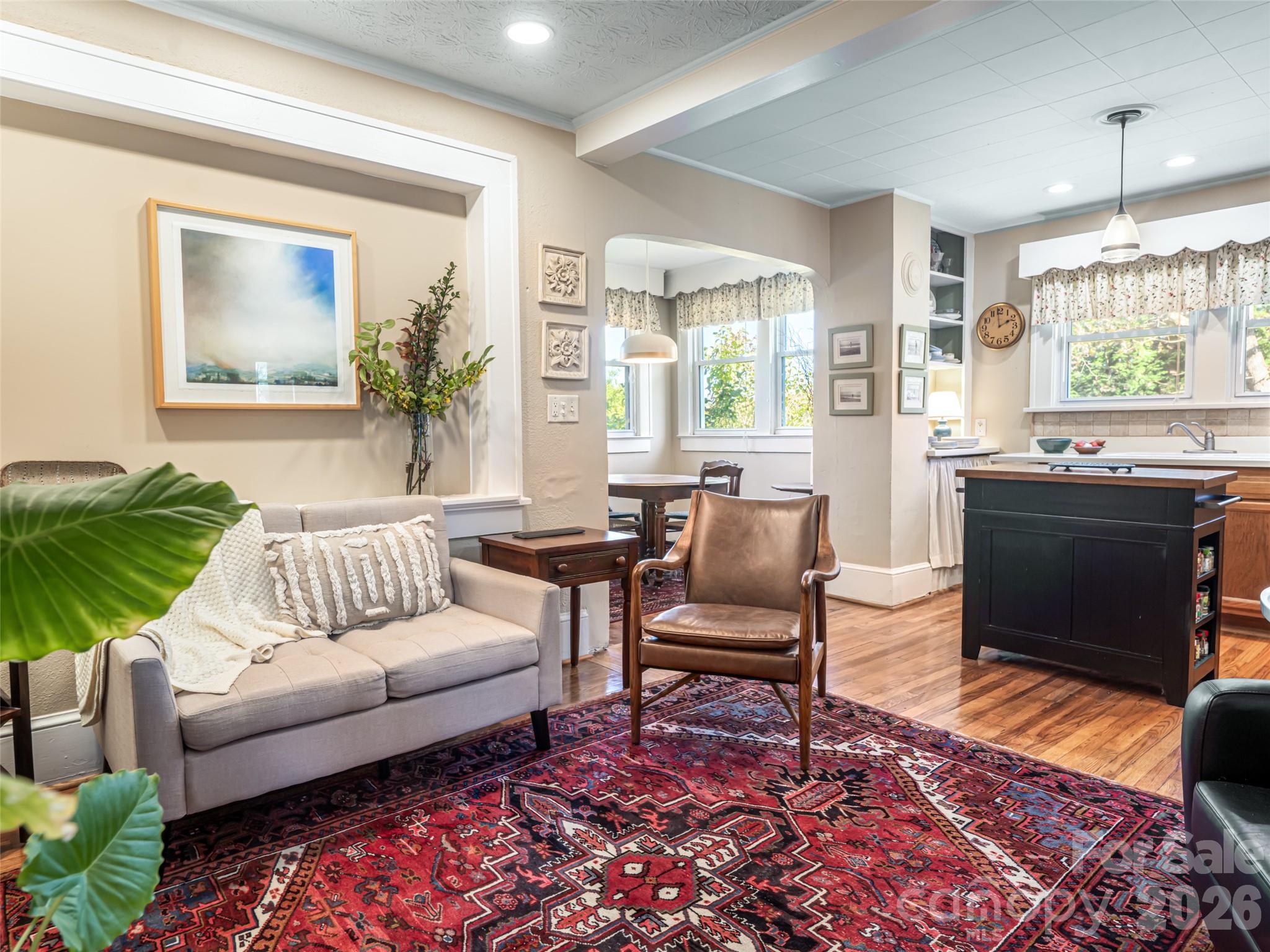 352 Justice Ridge Road Candler, NC 28715 - Photo 15 of 48 a living room with furniture and a large window