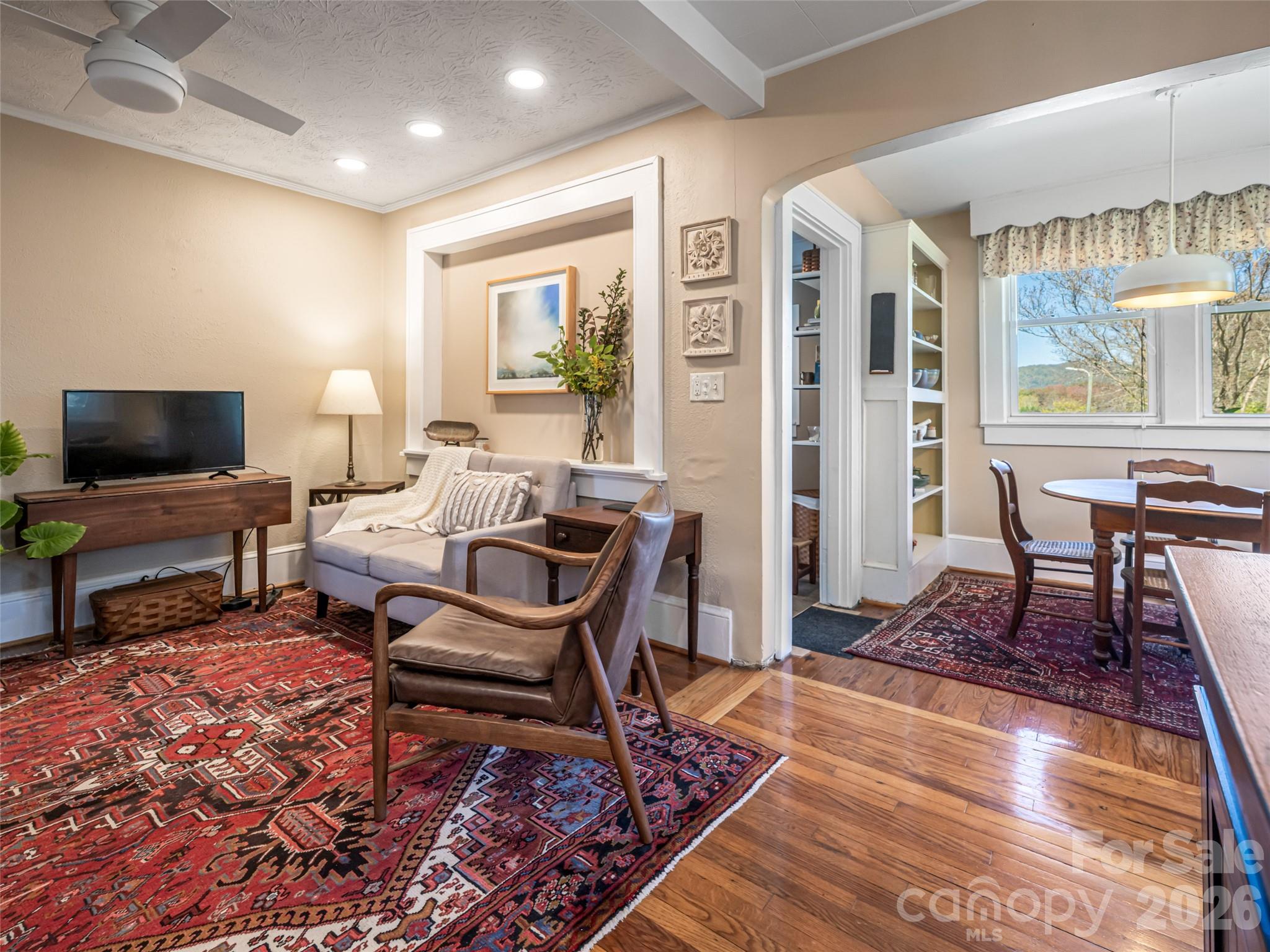 352 Justice Ridge Road Candler, NC 28715 - Photo 17 of 48 a living room with furniture and a flat screen tv