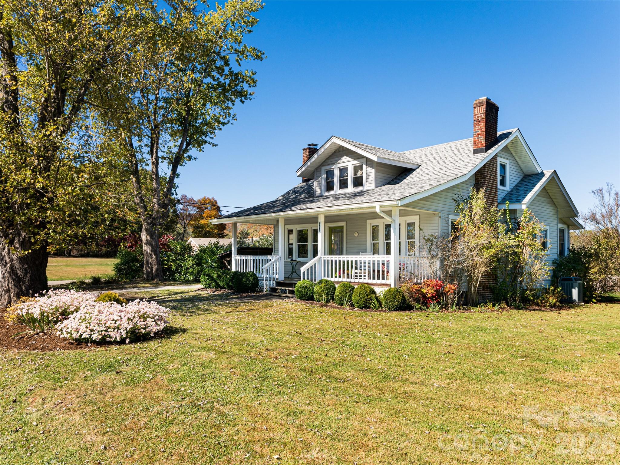 352 Justice Ridge Road Candler, NC 28715 - Photo 2 of 48 a front view of a house with a porch