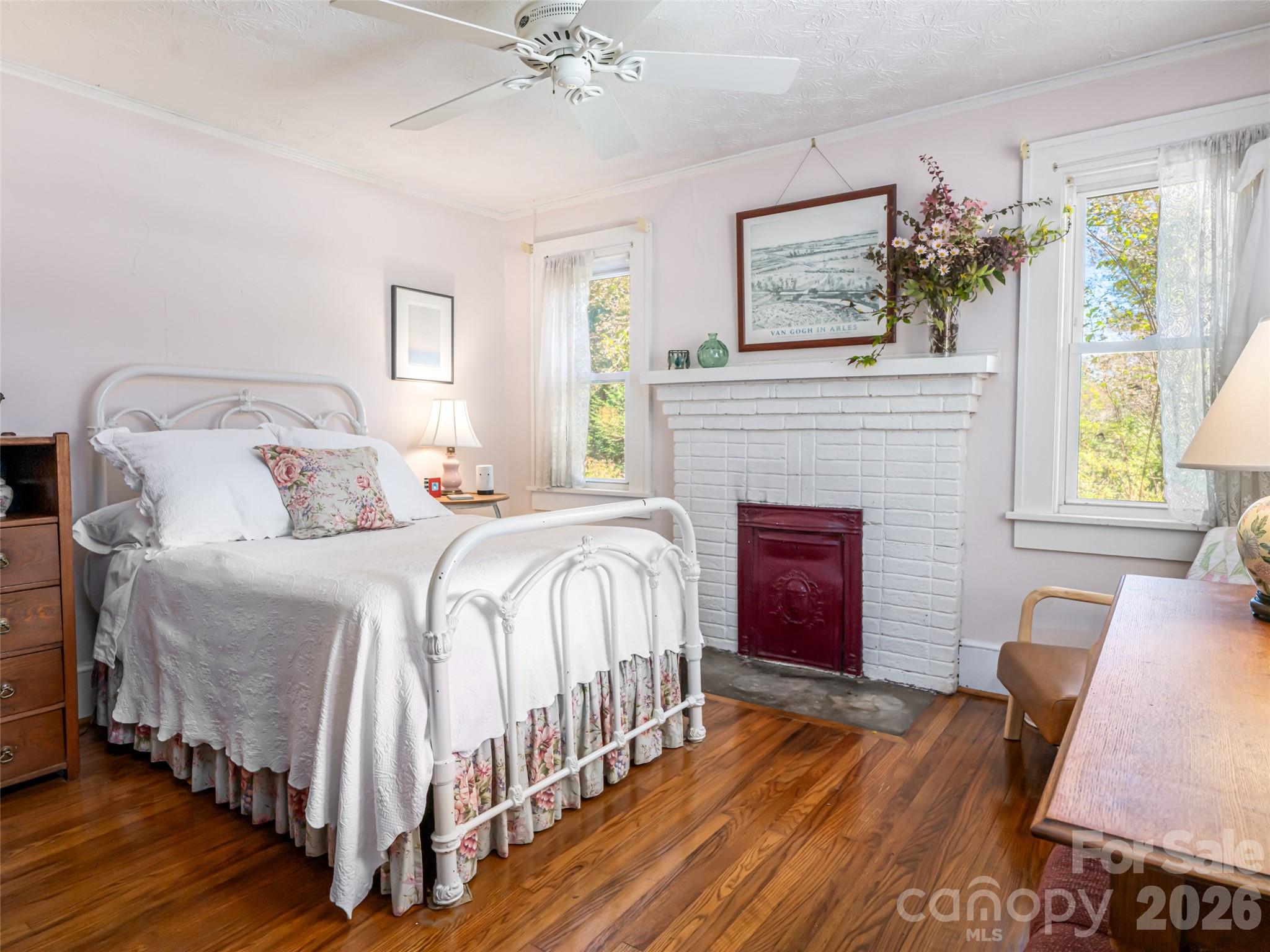 352 Justice Ridge Road Candler, NC 28715 - Photo 21 of 48 a bedroom with a bed and a fireplace