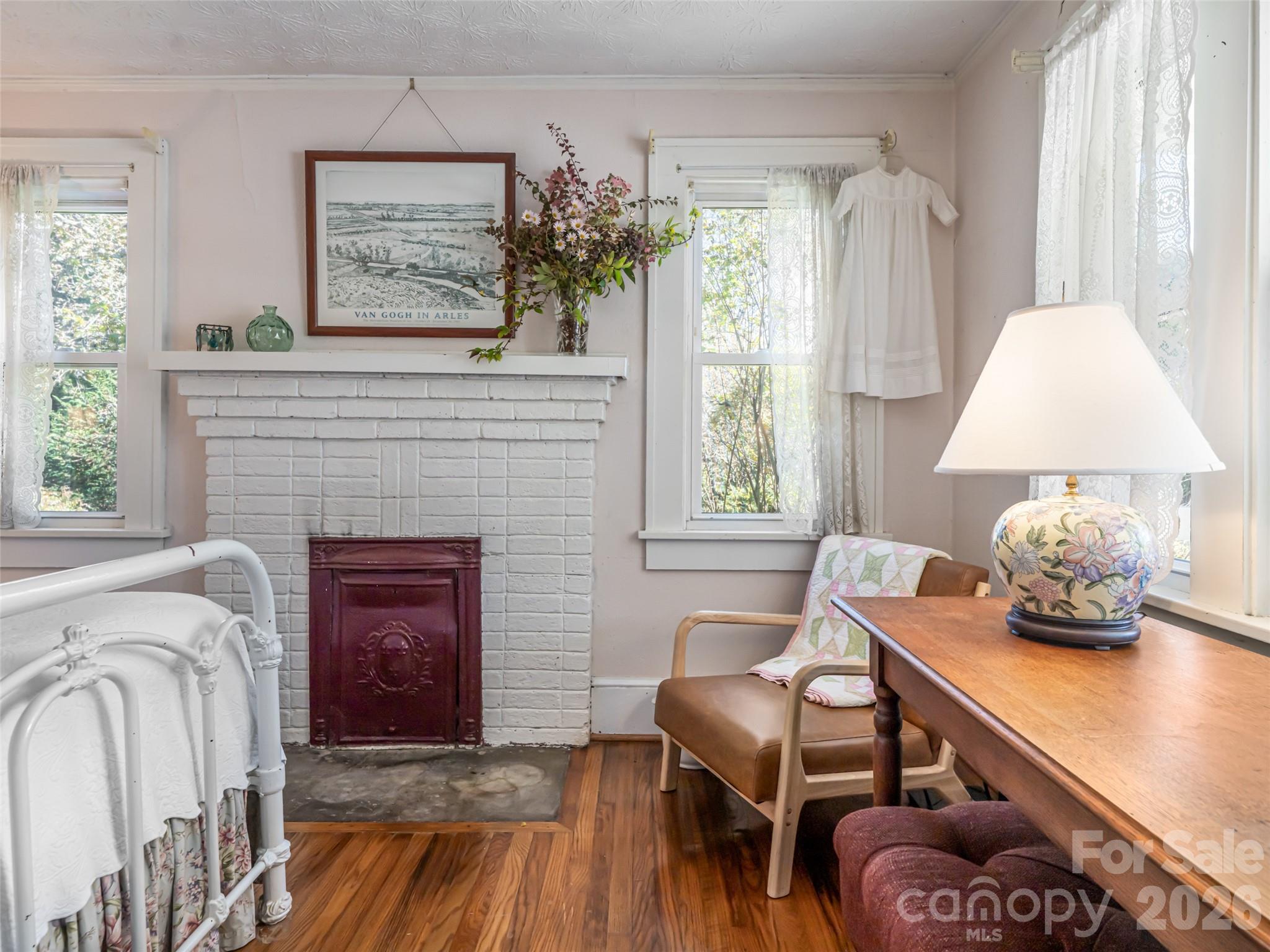 352 Justice Ridge Road Candler, NC 28715 - Photo 22 of 48 a living room with furniture and a fireplace