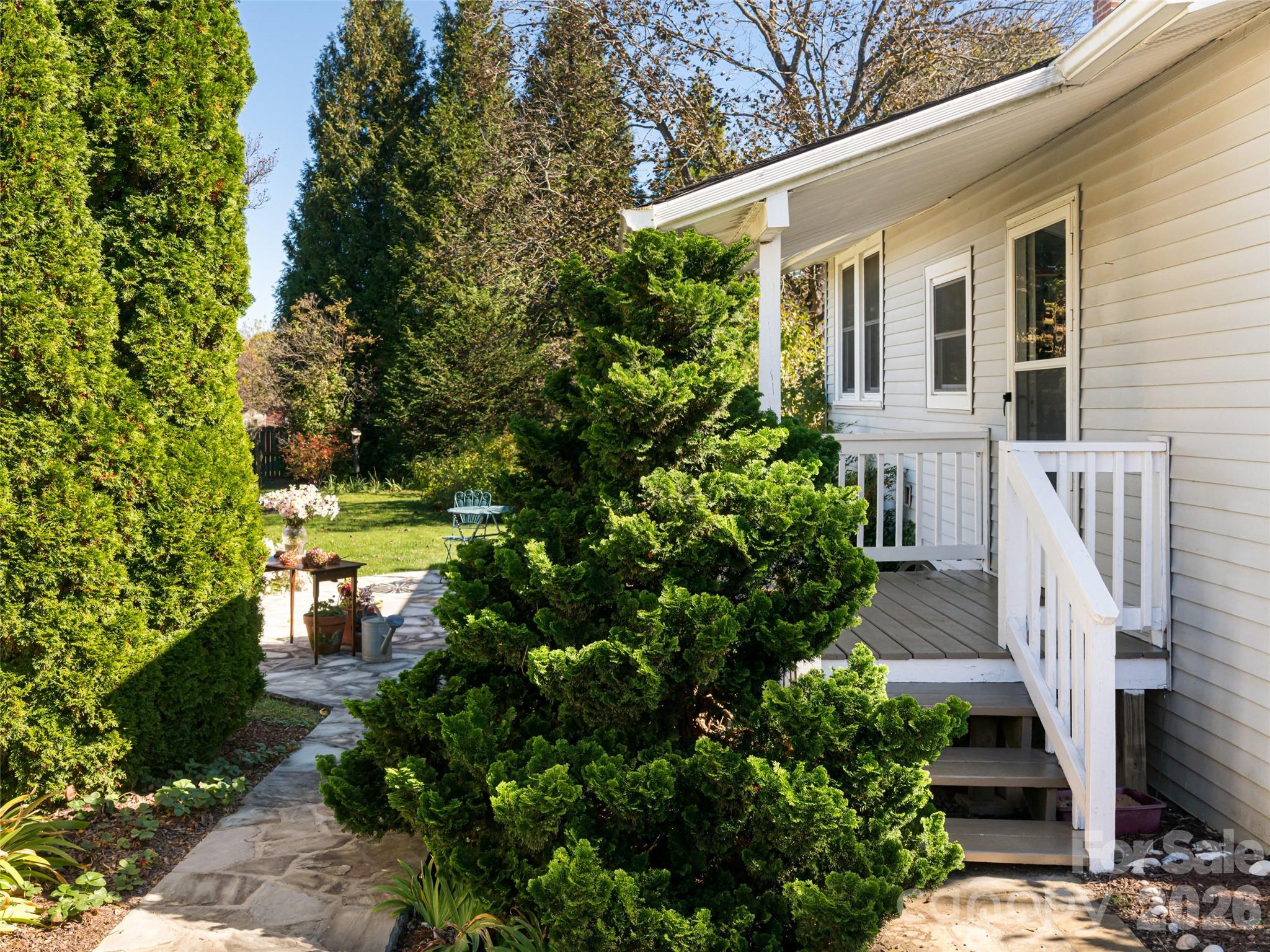 352 Justice Ridge Road Candler, NC 28715 - Photo 34 of 48 a front view of a house with a garden