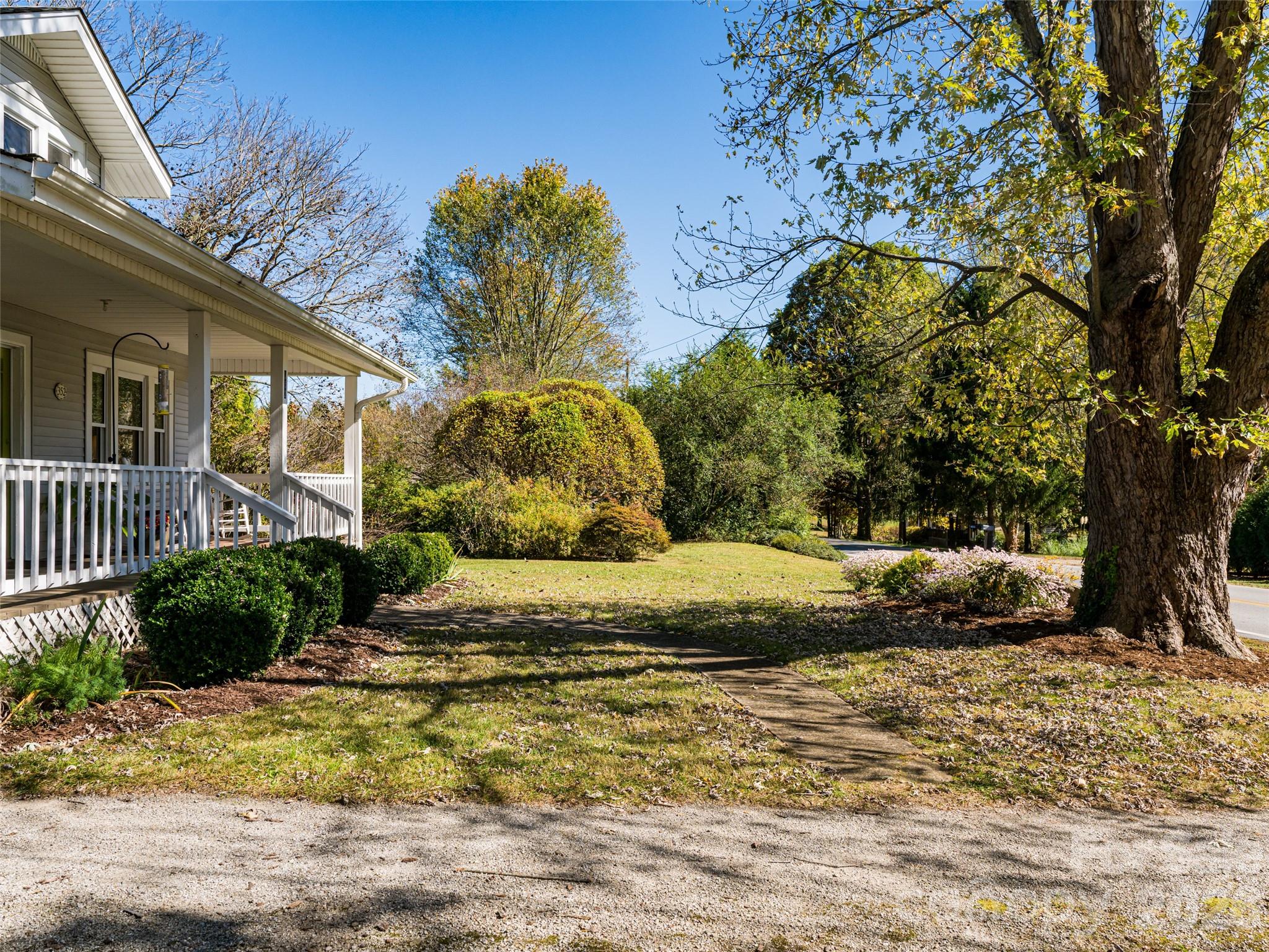 352 Justice Ridge Road Candler, NC 28715 - Photo 5 of 48 a view of a house with a yard