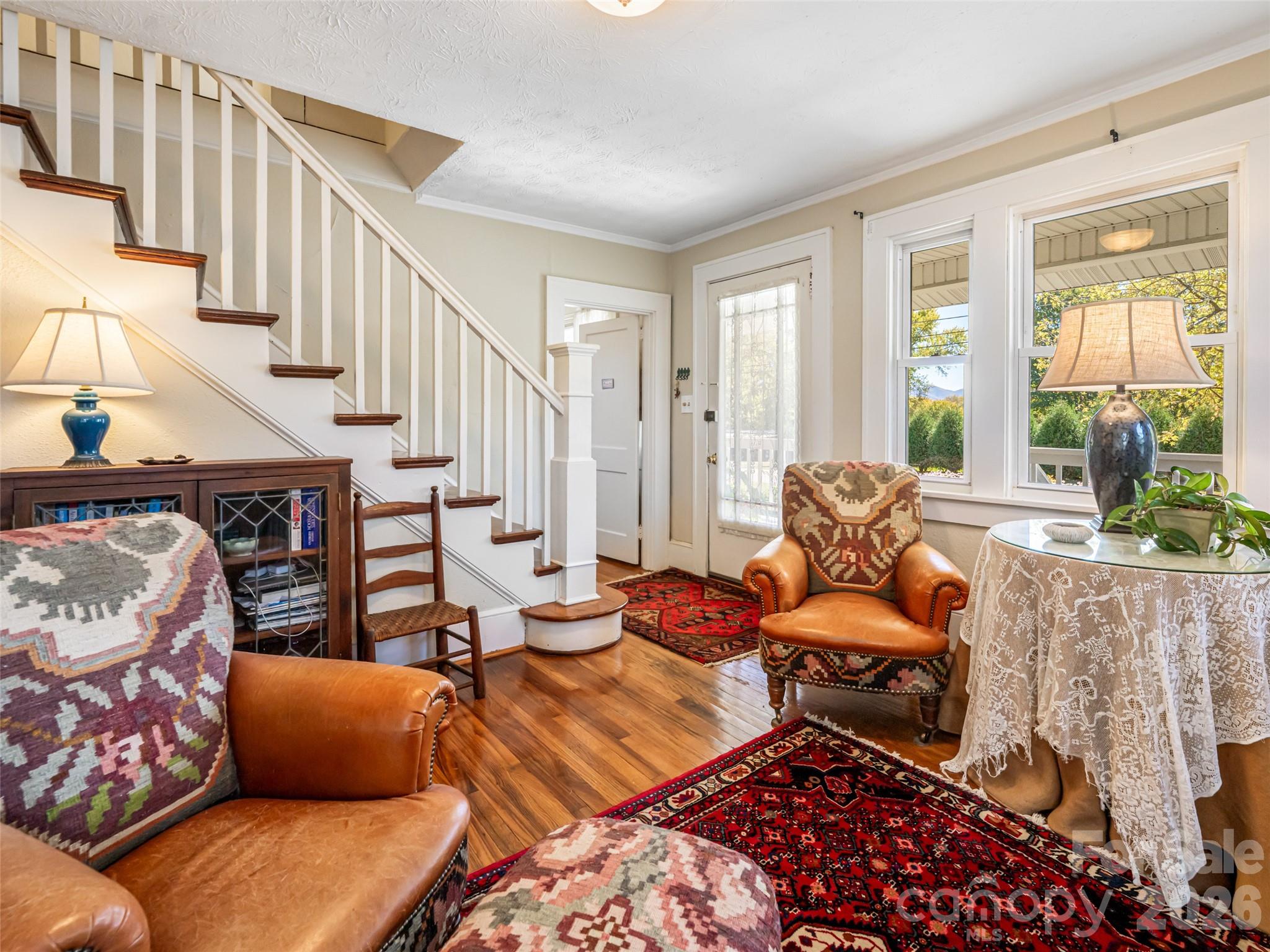 352 Justice Ridge Road Candler, NC 28715 - Photo 9 of 48 a living room with furniture and a rug