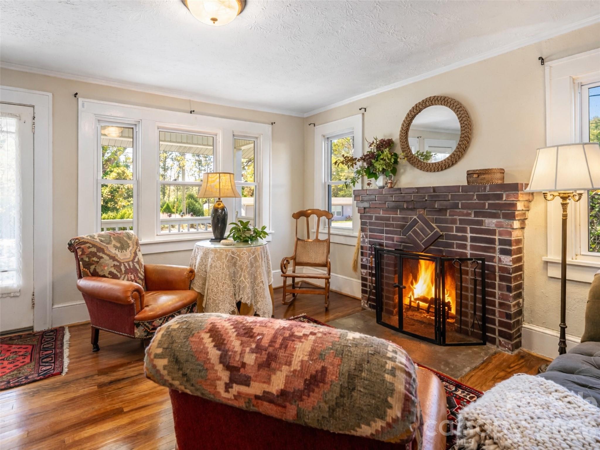352 Justice Ridge Road Candler, NC 28715 - Photo 10 of 48 a living room with furniture and a fireplace
