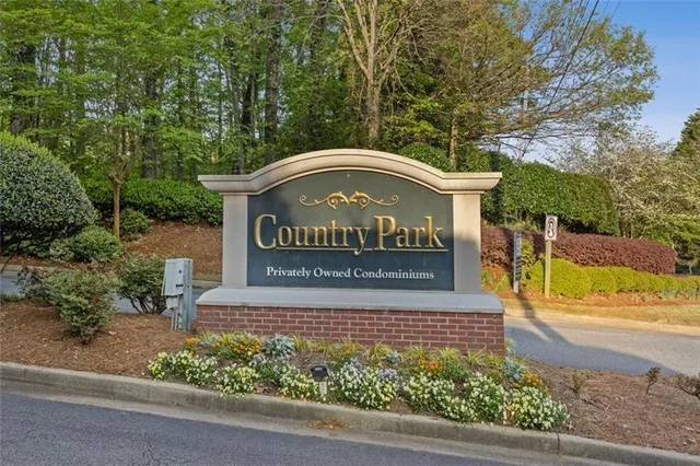 a view of outdoor space with signage and flags