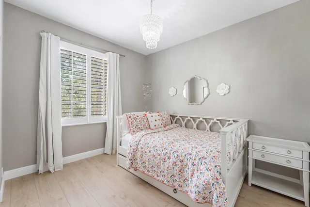 a view of swimming pool with outdoor seating and plants
