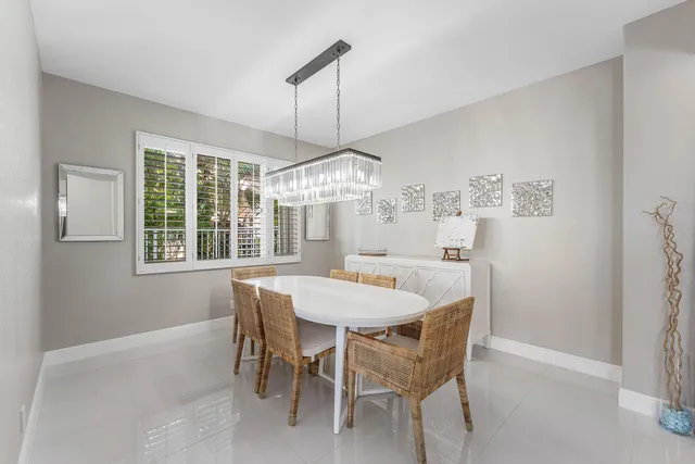 a kitchen with appliances a sink and cabinets
