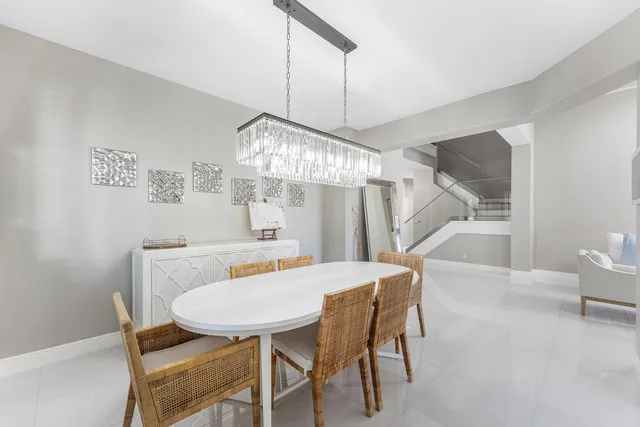 a kitchen with stainless steel appliances a refrigerator sink and cabinets