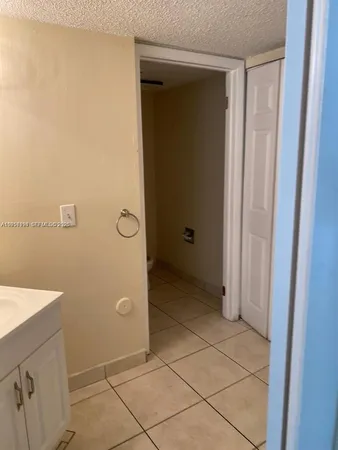 a bathroom with a shower and a sink