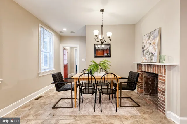 a view of a dining room with furniture wooden floor and chandelier