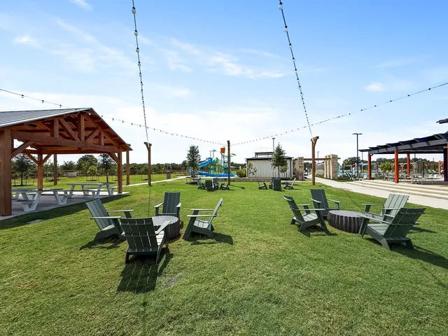 a view of a garden with sitting area