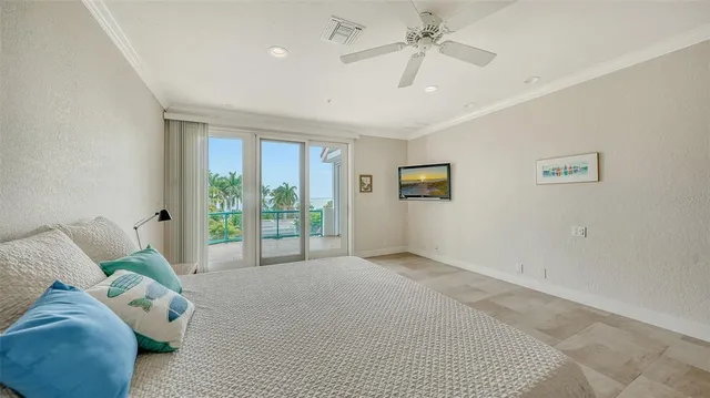 a front view of a house with a yard and potted plants