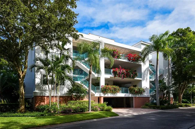 a view of a kitchen with a sink and white cabinets