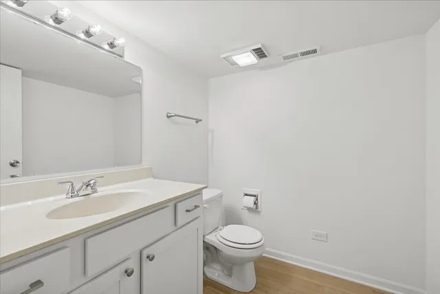 a view of an empty room with a fireplace