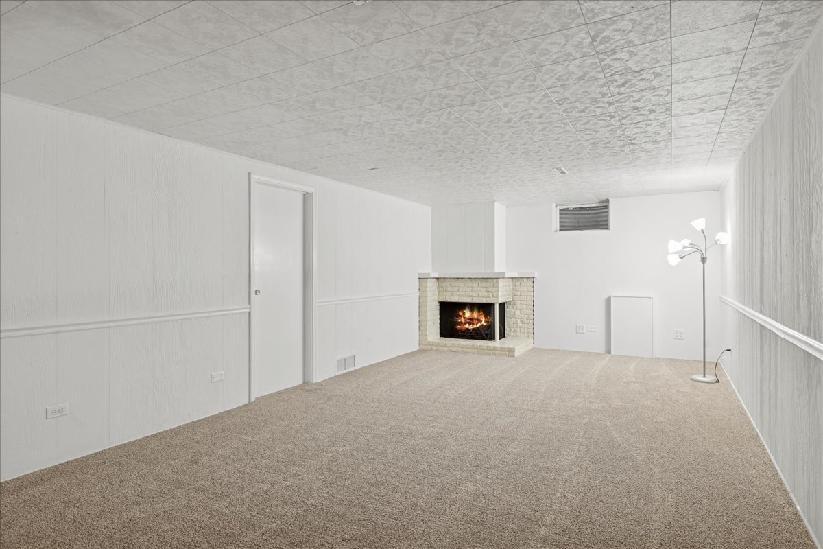 53 North McLean Boulevard Elgin, IL 60123 - Photo 12 of 16 a view of an empty room with a fireplace