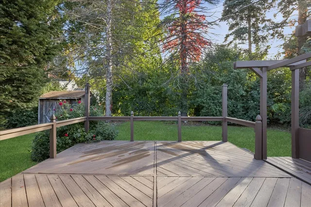 a view of a house with a backyard and a patio