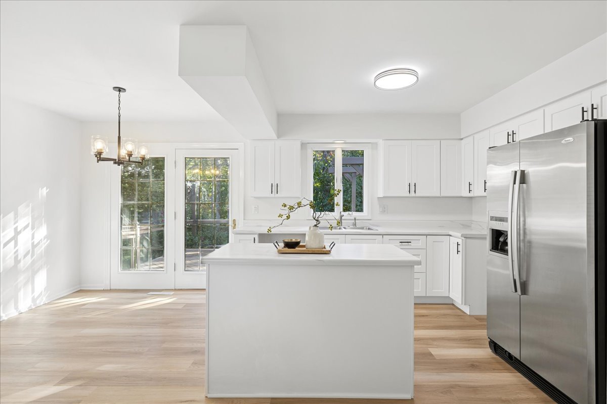 53 North McLean Boulevard Elgin, IL 60123 - Photo 3 of 16 a kitchen with kitchen island a sink appliances and cabinets