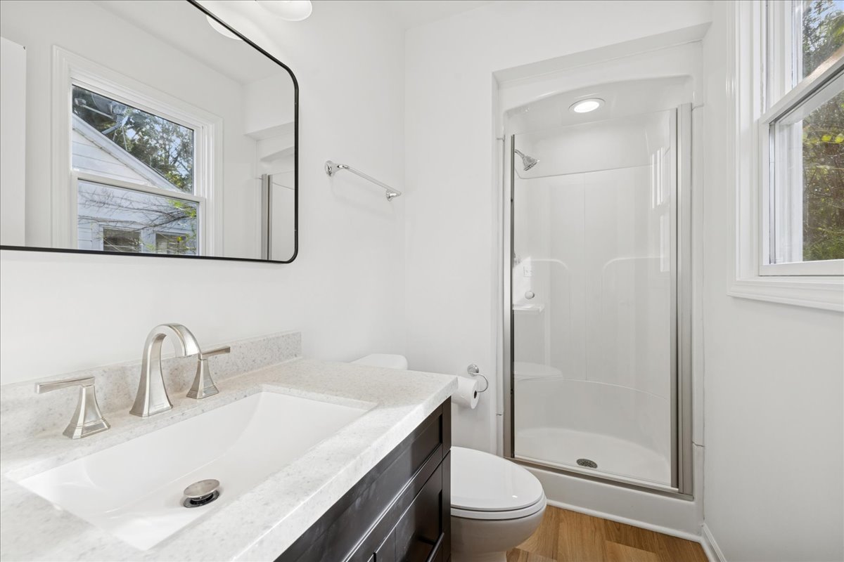 53 North McLean Boulevard Elgin, IL 60123 - Photo 8 of 16 a bathroom with a sink a toilet and shower