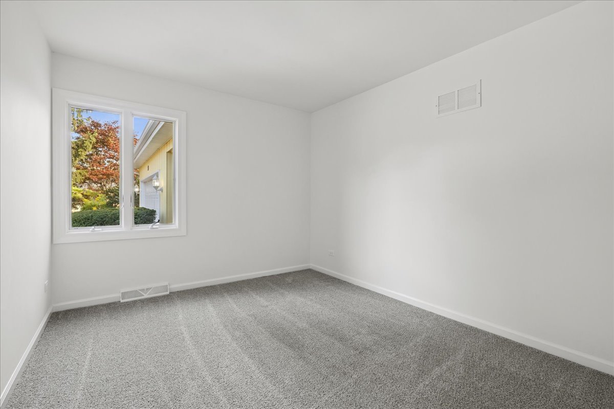 53 North McLean Boulevard Elgin, IL 60123 - Photo 10 of 16 an empty room with a window