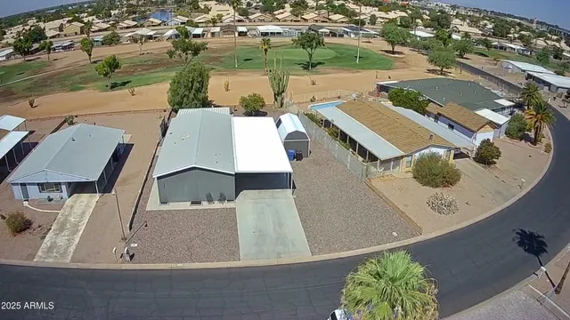 an aerial view of a house with outdoor space