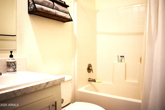 a bedroom with a couch and a couch