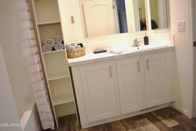a dining room with wooden floor and outdoor seating