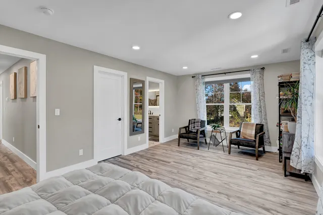 a bed room with furniture and a chandelier