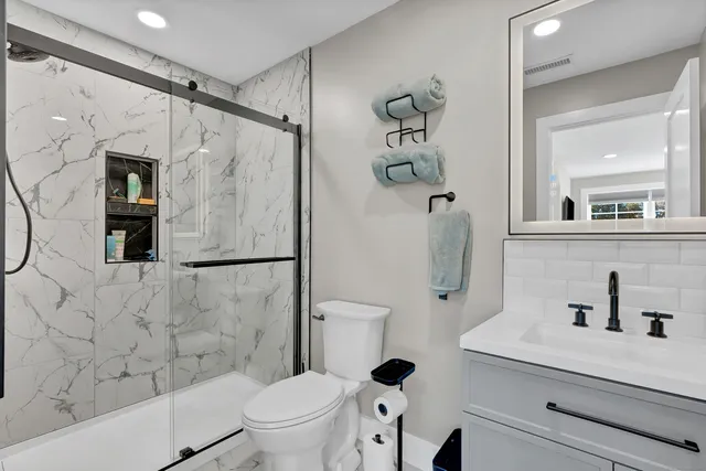 a bed room with a bed and a chair