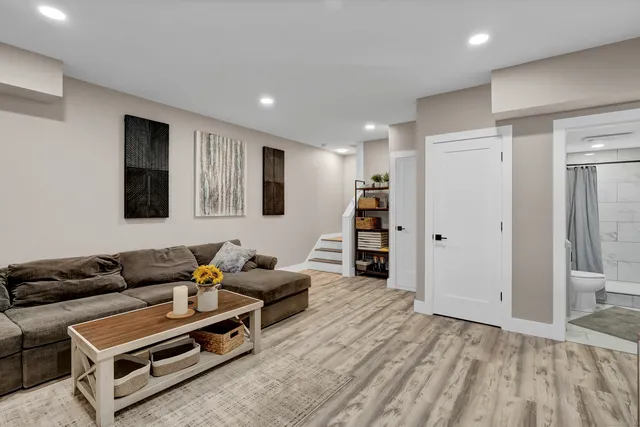 an aerial view of a house with garden space ocean and mountain view in back