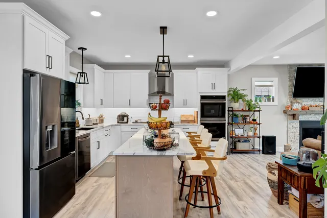 a very nice looking dining room with a table and chairs in it