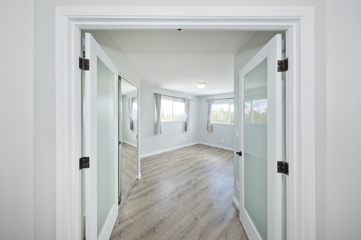 11-2420 Ohialani Road Mountain View, HI 96771 - Photo 18 of 30 a view of a hallway with wooden floor