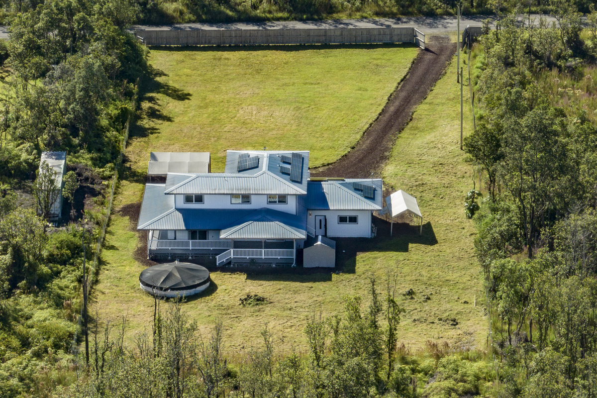 11-2420 Ohialani Road Mountain View, HI 96771 - Photo 29 of 30 a view of a house with pool and ocean view