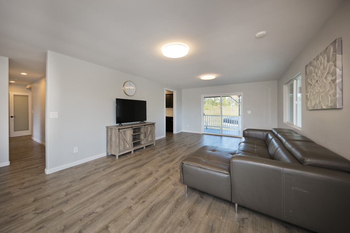 11-2420 Ohialani Road Mountain View, HI 96771 - Photo 10 of 30 a living room with furniture and a flat screen tv