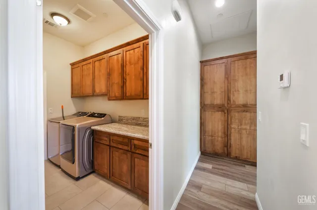 a view of a kitchen with washer and dryer