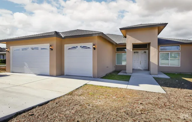 a front view of a house with yard