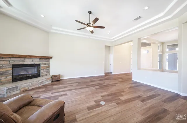 a view of livingroom with hardwood floor and a ceiling fan