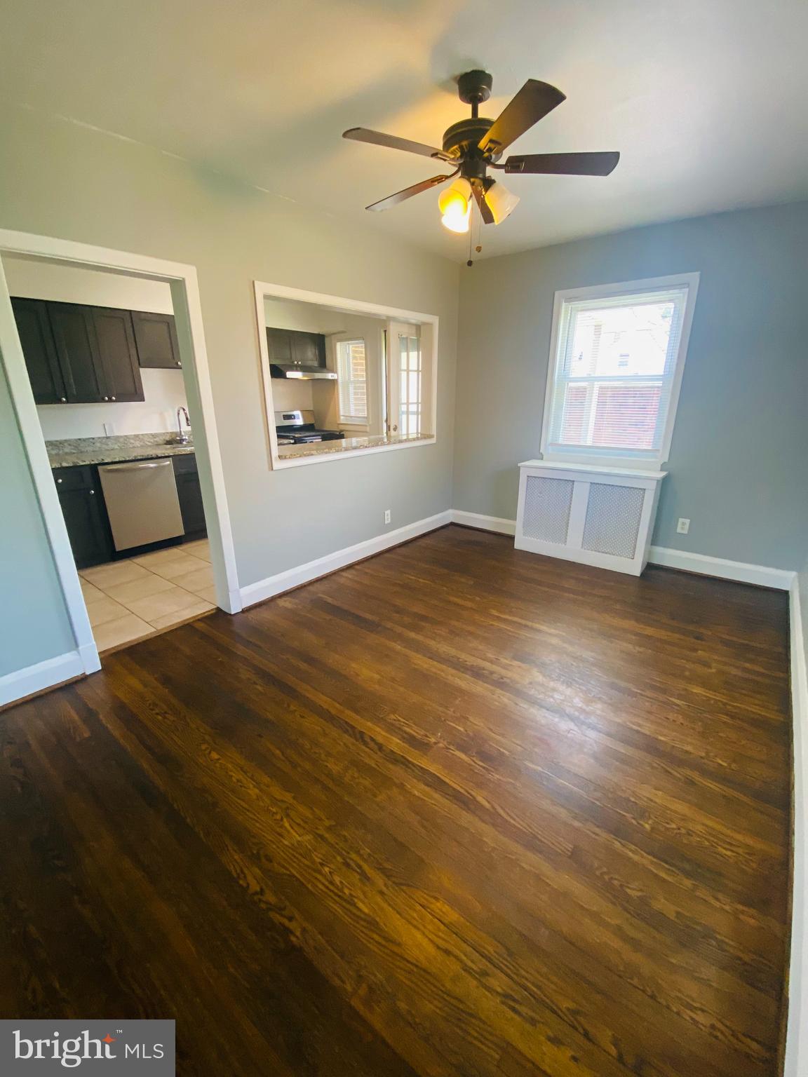 2504 Liberty Parkway Dundalk, MD 21222 - Photo 4 of 21 a view of a bedroom with wooden floor and a window