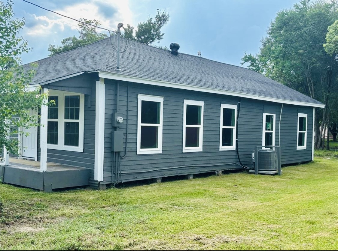 1314 Sabine Street Orange, TX 77630 - Photo 2 of 9 a view of a house with a yard