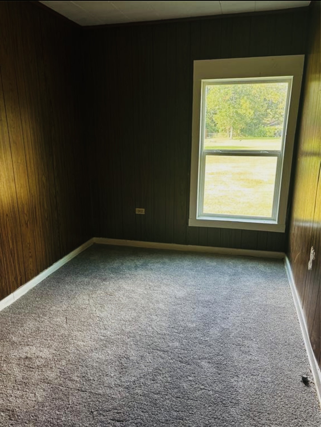 1314 Sabine Street Orange, TX 77630 - Photo 4 of 9 an empty room with a window