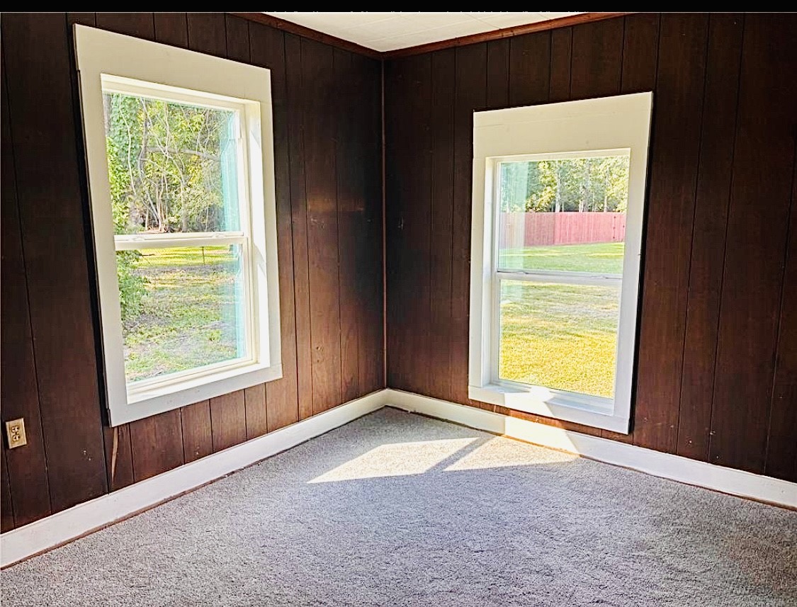 1314 Sabine Street Orange, TX 77630 - Photo 7 of 9 an empty room with a window