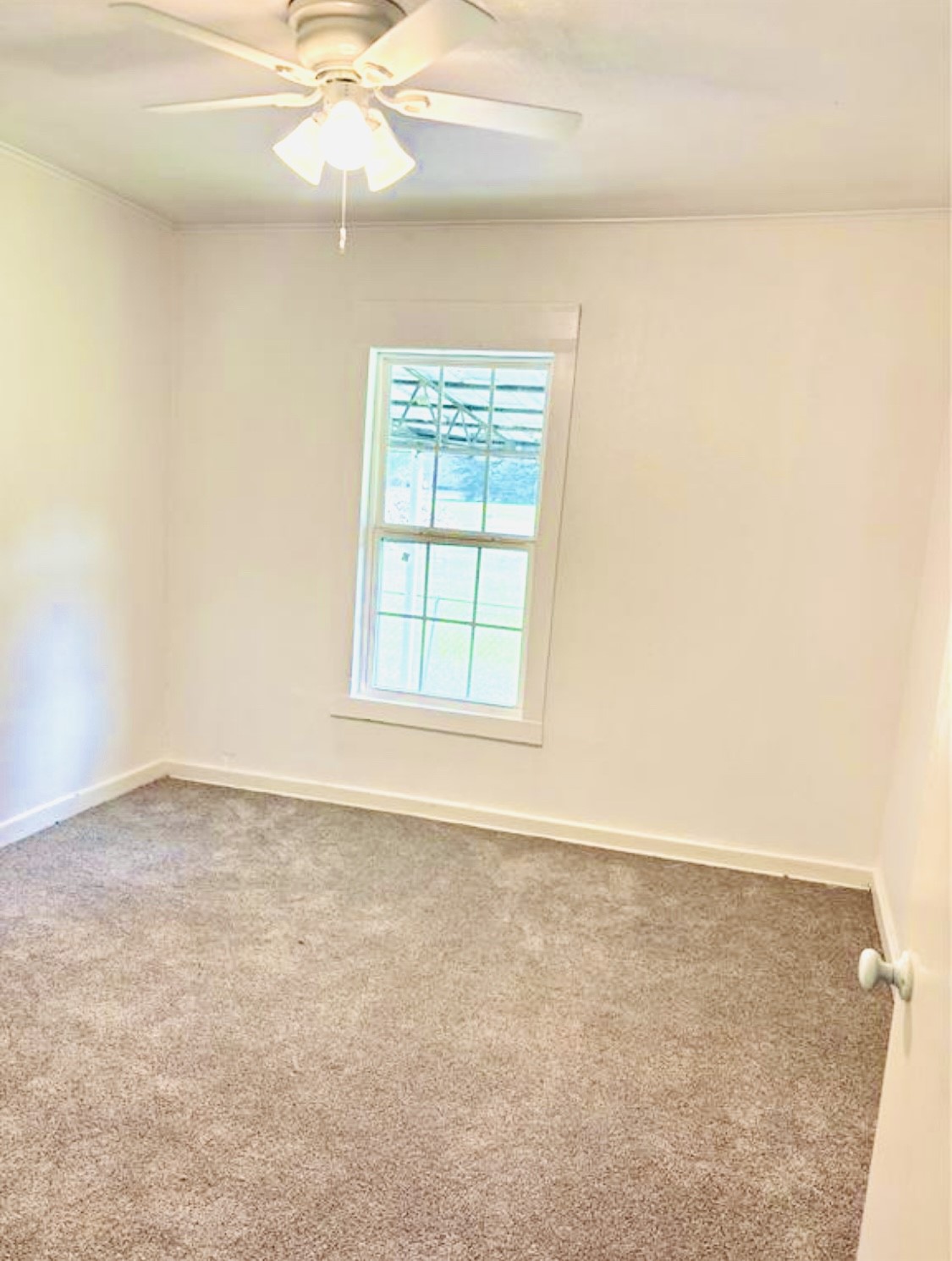 1314 Sabine Street Orange, TX 77630 - Photo 9 of 9 an empty room with a window